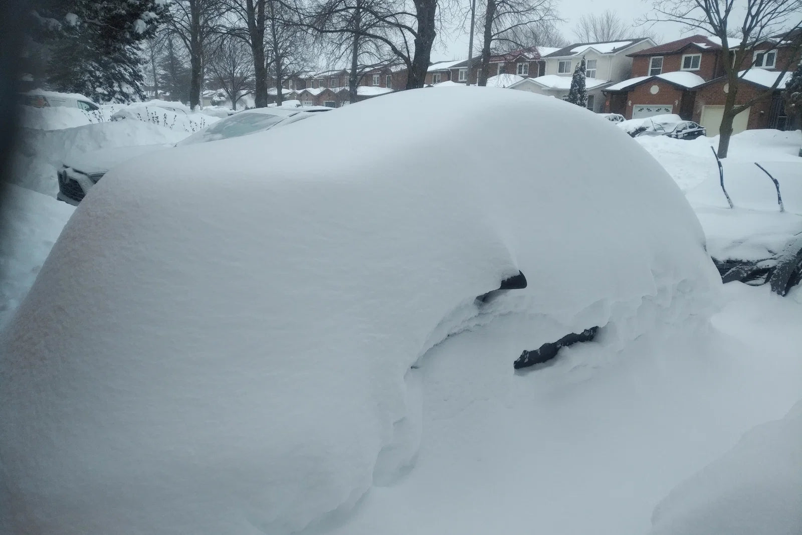 Car covered in snow during cold weather