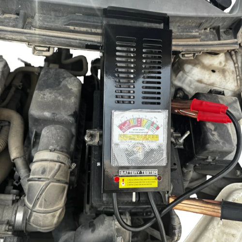 100A Battery Load Tester side view showing ventilated steel body and carry handle